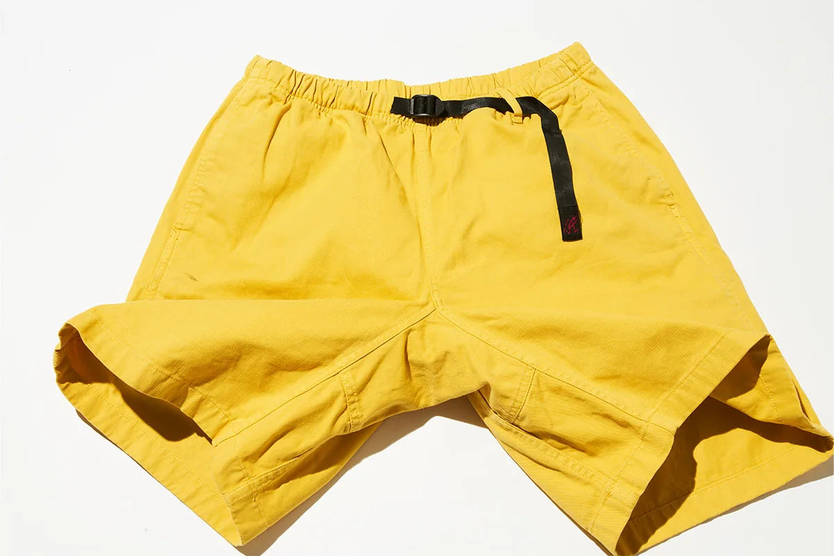 Yellow shorts with a black strap