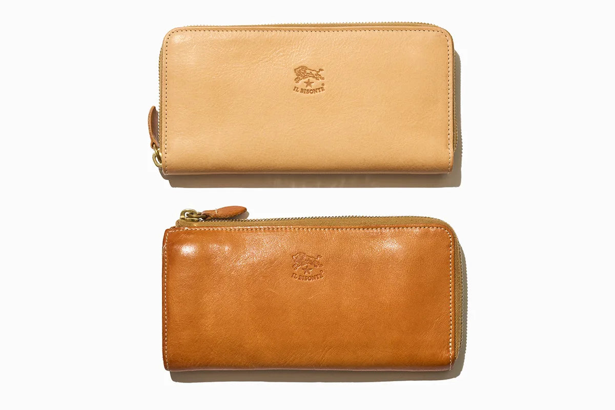 Two IL BISONTE leather long wallets top one is lighter brown, and the bottom is light brown both with the logo 