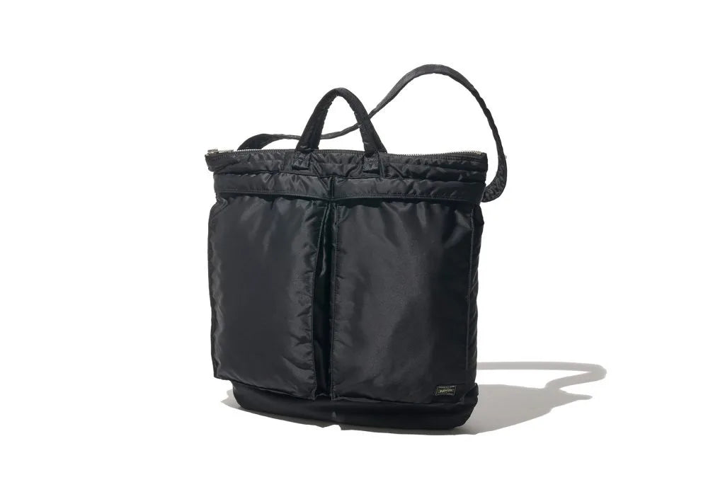 Black bag with two front large pockets, a handle and a large handle