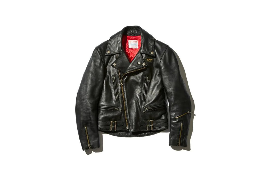 Black leather jacket with a few zippers on the front and a red interior