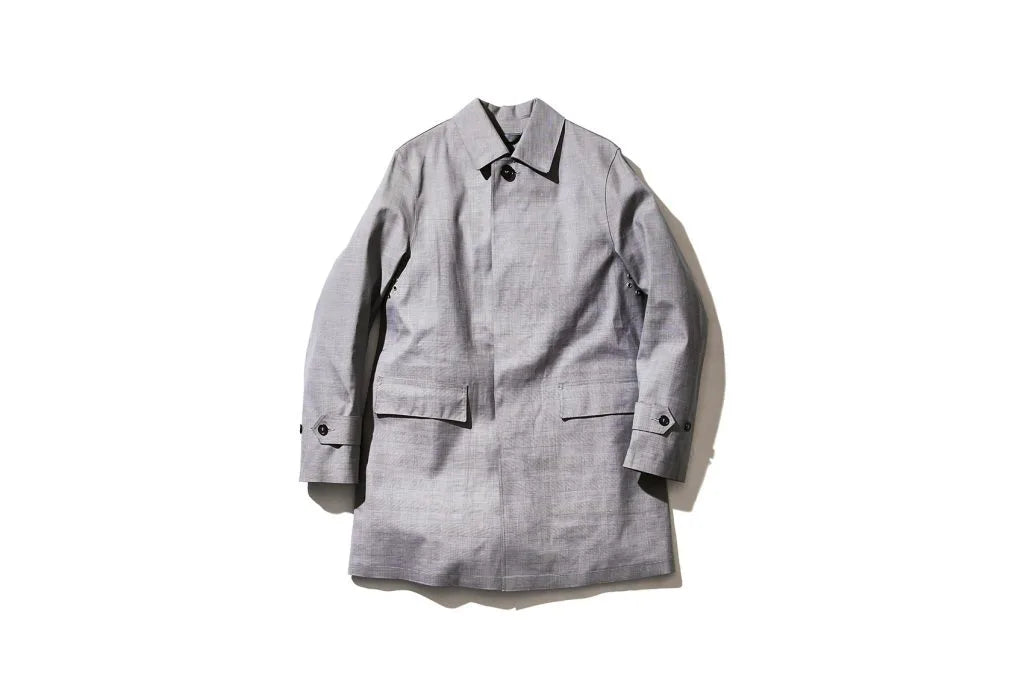 Light gray trench coat with front pockets
