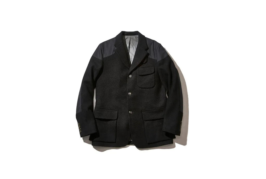 Black blazer with a front pocket and two lower front pockets
