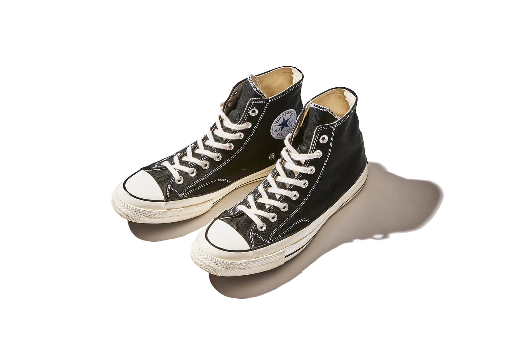 A pair of a classic Converse black and white sneakers 