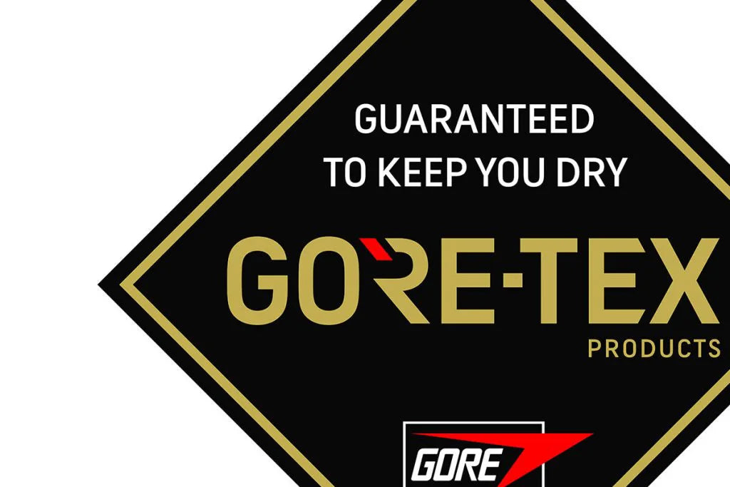 A logo tag that says "guaranteed to keep you dry" Gore-Tex Products