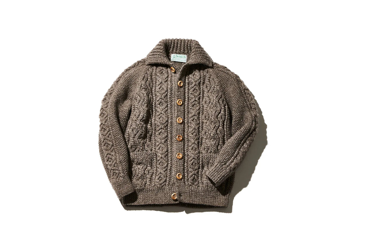 Brown cable-knit cardigan with a collared neckline, wooden buttons, and front pockets