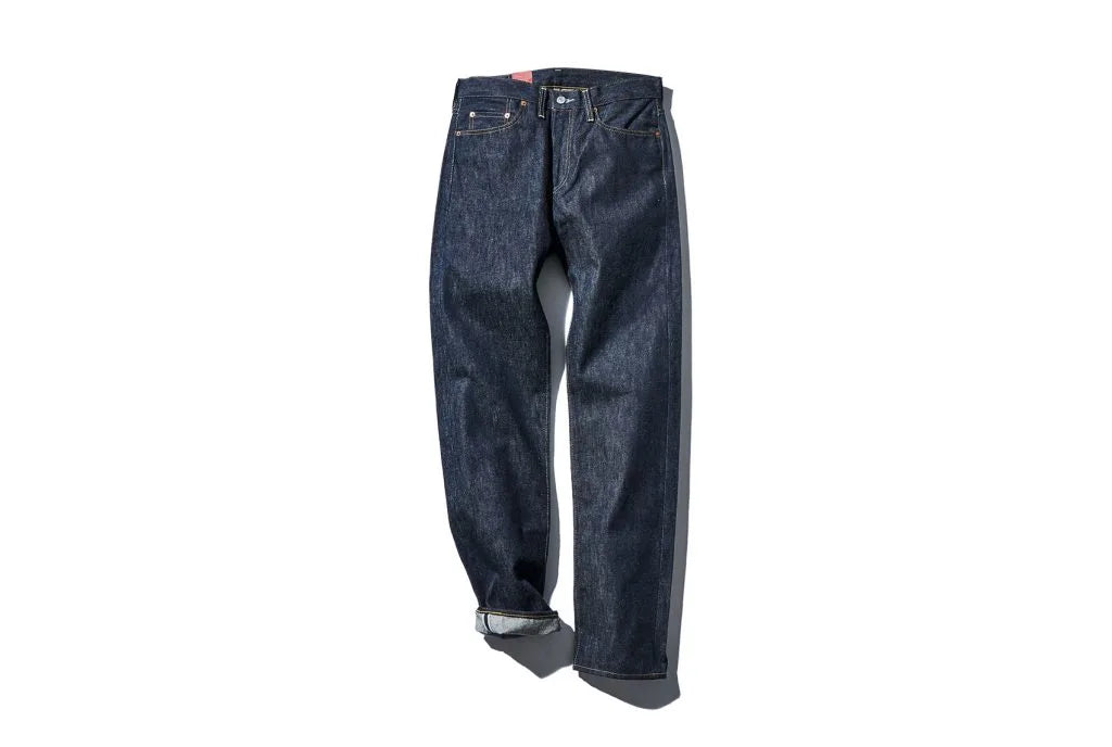 Dark blue denim jeans with the left bottom folded