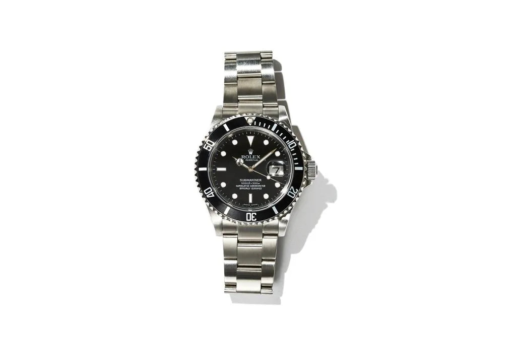 Wrist watch with a black dial and silver band