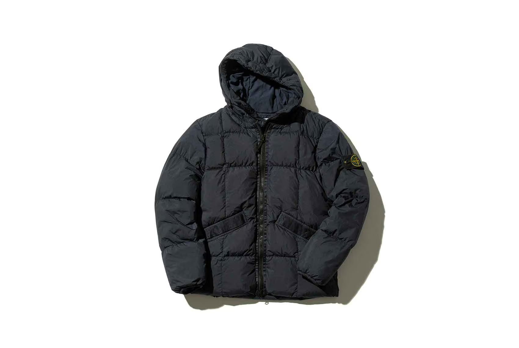 Black puffer jacket with a hoodie and a logo on the side arm