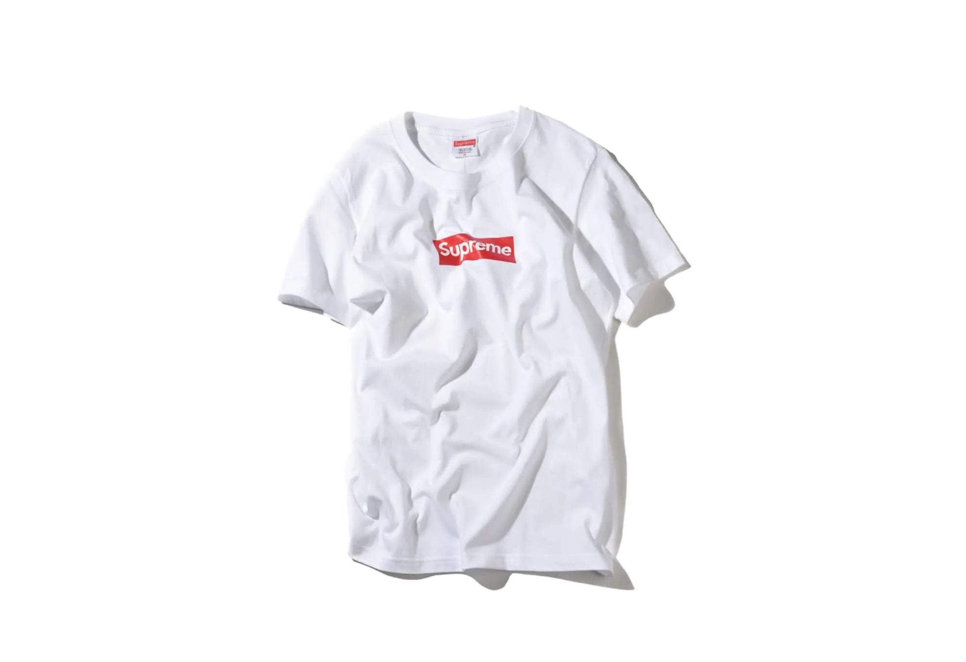 White tee with the red and white Supreme logo in the front