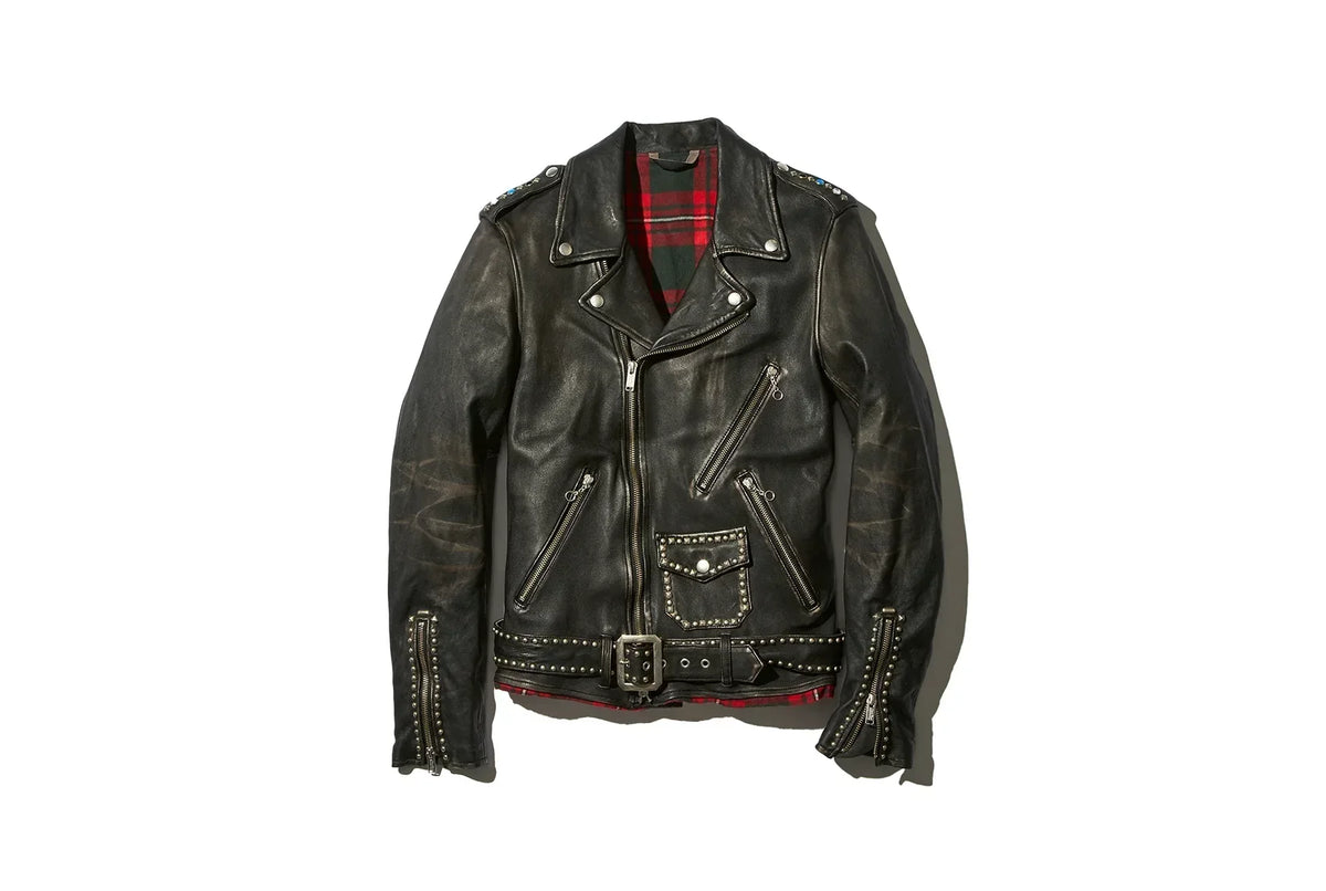 Black leather motorcycle jacket with red plaid lining, multiple zippered pockets, studs, and a belted waist