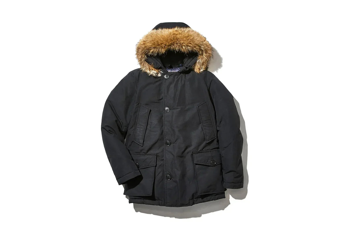 Black jacket with buttons and a hoodie with fur