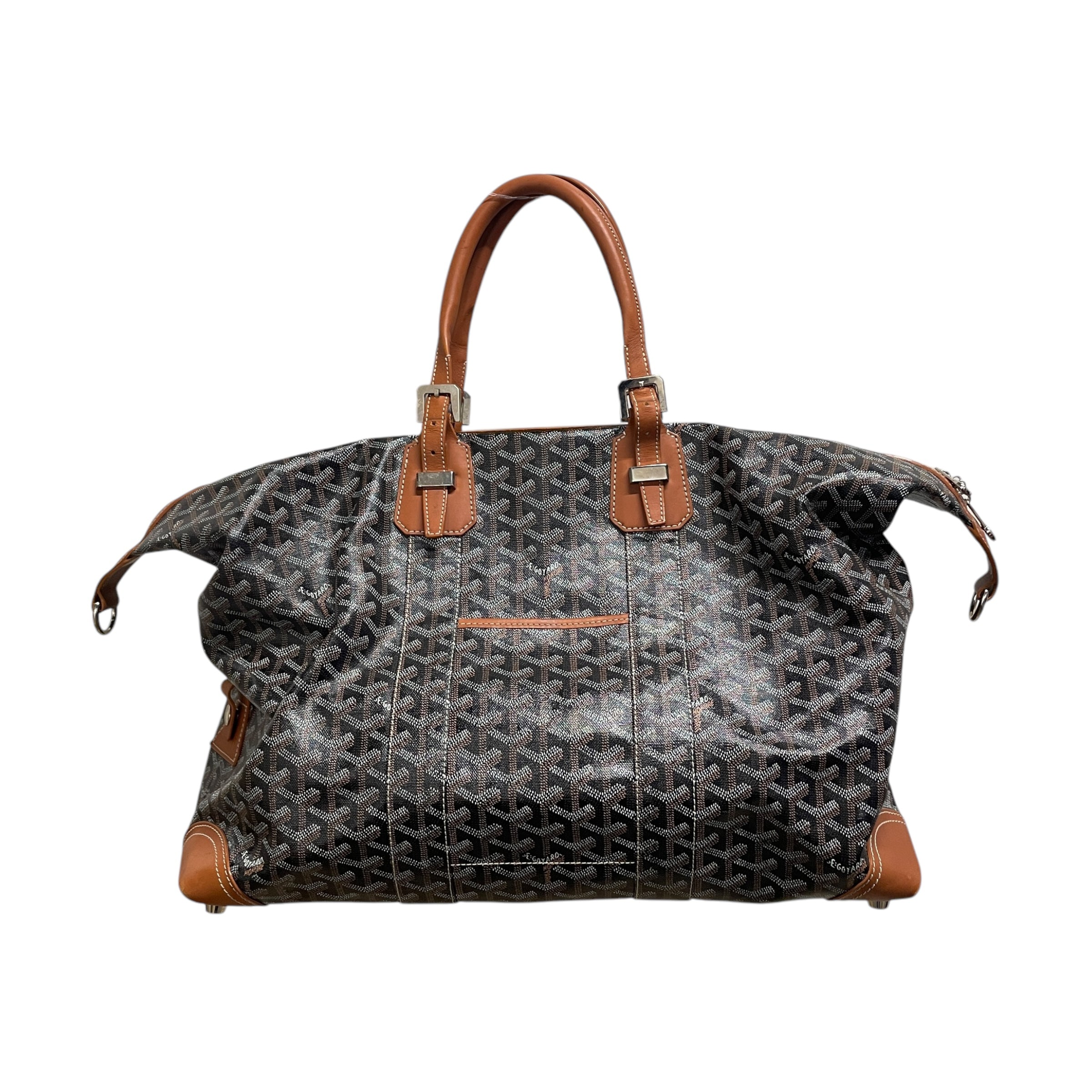 A brown GOYARD duffel bag with monogram pattern and leather trim. view 1