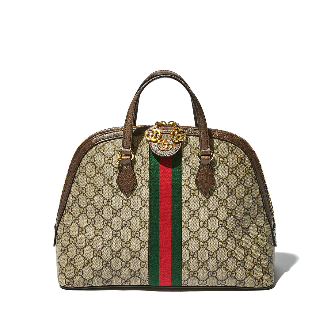 Gucci dome-shaped handbag in beige GG Supreme canvas with brown leather trim, a green and red web stripe down the center, and a gold-tone interlocking G logo clasp on the front.